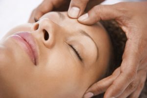 woman receiving a head massage